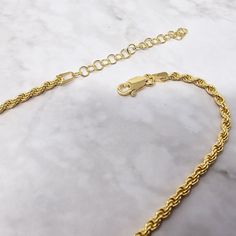 The rope chain necklace is an effortless essential. Dipped in gold, it provides you with affordable every day luxury.  This eye catching piece combines high quality craftsmanship and precious metal without the hefty price tag. Ethically-sourced and affordable, so you can look as good as you feel, every day.  This jewellery arrives beautifully packaged and ready to gift. It would make a really thoughtful and meaningful birthday gift, Christmas gift, Mother's Day gift, Valentine's Day gift, annive Elegant Gold Adjustable Rope Chain Necklace, Elegant Gold Rope Chain Necklace With Adjustable Chain, Minimalist Gold Rope Chain Necklace, Minimalist Rope Chain Link Jewelry, Gold Rope Chain Necklace As A Gift, Minimalist Gold Rope Chain Necklace With Adjustable Chain, Everyday Gold Rope Chain Necklace With Delicate Chain, Elegant Gold Rope Chain Necklace, Minimalist Yellow Gold Rope Chain Necklace For Everyday