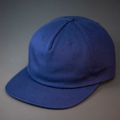 An Unstructured, 100% Premium Cotton, Blank Pinch Front Hat With a Premium Leather Back Strap & Brass Clasp. One of our teams favorite pieces, this unassuming, unstructured pinch front 5 panel is one for the ages. Constructed from a sturdy, medium weight, 100% Cotton base and finished with a premium leather strap & Brass Clasp. We designed the ROAM Strapback for the adventurer in all of us. Custom Roam Strapback Hat in Navy | Cotton | Apparel | Headwear | Baseball Caps Navy Flat Brim Baseball Cap, Navy Flat Brim Baseball Cap, One Size, Navy Adjustable 5-panel Baseball Cap, Navy Adjustable Baseball Cap With Flat Brim, Navy Adjustable Snapback Hat With Flat Bill, Navy Flat Brim Baseball Cap For Sports Events, Navy Snapback Hat With Flat Brim, Cotton Flat Brim Dad Hat For Sports, Navy Flat Brim Baseball Cap For Streetwear