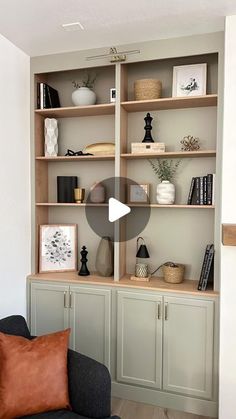 a living room filled with furniture and lots of shelves