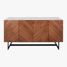 the sideboard is made out of wood and has white marble top, black metal legs