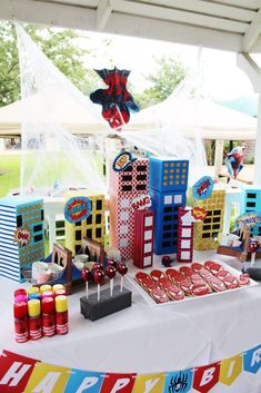 a table topped with lots of candy and decorations