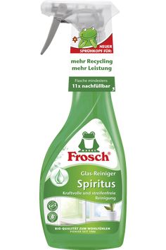 a bottle of spray on a white background with a green frog sitting on top of it