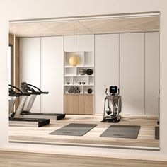 an exercise room with treadmills, machines and other items in the mirror on the wall