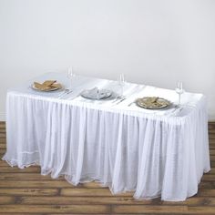 the table is covered with white linens