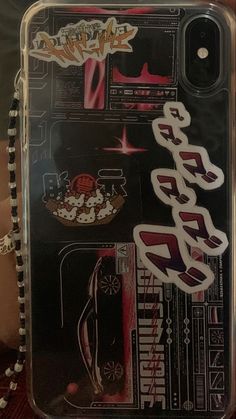 an iphone case with some stickers on the front and back cover in japanese writing