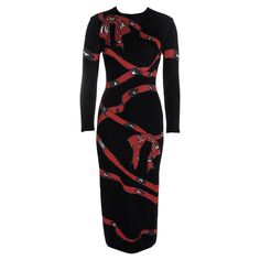 ▪ Azzedine Alaia black rayon knitted bodycon dress ▪ Red ribbon and bow graphic ▪ Centre back leg slit with concealed zipper ▪ Long sleeves ▪ Calf length ▪ Size Medium ▪ Fall-Winter 1992 Ribbon Graphic, Bow Graphic, Knit Jacquard, Wool Knitted Dress, Black Long Sleeve Sweater, Azzedine Alaia, Red Bodycon Dress, Iconic Dresses, 1980s Dresses