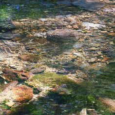 the water is crystal clear and there are rocks in it