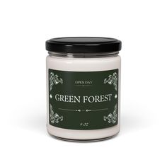 green forest candle in a glass jar