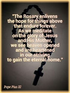 a rosary with the words pope pius xi on it and an image of a cross