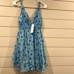 Urban Outfitters Smocked Mini Dress Nwt!! Light Blue Vacation Dress With Smocked Back, Blue Floral Smocked Sundress, Blue Floral Print Smocked Sundress, Light Blue Beach Dress With Smocked Back, Blue Flowy Smocked Sundress, Fitted Blue V-neck Smocked Dress, Blue Fitted V-neck Smocked Dress, Blue V-neck Mini Dress With Smocked Bodice, Light Blue Smocked Back Sundress