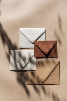 three envelopes sitting on top of each other