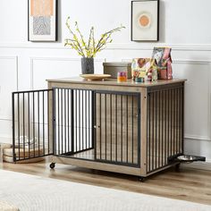 a dog crate sitting on top of a hard wood floor next to a white rug