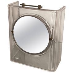 a clear plastic box with a mirror on it