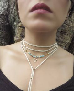 "Boho Hamsa Necklace, Yoga Jewelry, Delicate Choker Necklace, Gold Wrap Necklace, Minimalist Wrap Choker, Suede Choker, Boho Tie Up Necklace ❤ BUY ANY 2 ITEMS ANS GET 15% OFF!! (USE COUPON CODE '15OFF') ❤ ❤ BUY ANY 4 ITEMS ANS GET 20% OFF!! (USE COUPON CODE '20OFF') ❤ ❤ BUY ANY 6 ITEMS AND GET 25% OFF!! ((USE COUPON CODE '25OFF') ❤ Complete any outfit with this unique gorgeous fashionable and trendy delicate Hamsa choker wrap necklace ! Made from one long 3x1mm suede leather cord, 6mm faceted ro White Adjustable Chain Layered Choker Necklace, White Adjustable Choker Layered Necklace, White Choker Layered Necklace With Adjustable Chain, White Layered Choker Necklace With Adjustable Chain, Adjustable Minimalist Layered Choker Necklace, Minimalist Adjustable Layered Clavicle Necklace, White Minimalist Layered Necklace With Adjustable Chain, Minimalist Adjustable Long Layered Necklace, Minimalist Long Adjustable Layered Necklace