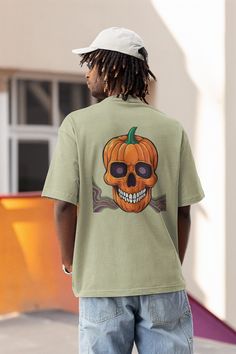 This oversized, drop shoulder t-shirt is a must-have for those who love comfort with style. Featuring a bold "TRIPPY" graphic on the front and a striking pumpkin skull design on the back, this tee is available in multiple colors to suit your vibe. Perfect for a laid-back yet statement-making look. Material: 100% premium cotton for a soft and breathable feel. Fit: Oversized with a relaxed, slightly dropped shoulder for a contemporary look. Neckline: Classic crew neck. Construction: Double-stitched hems for enhanced durability. Care Instructions: Washing: Machine wash cold with like colors. Drying: Tumble dry low or hang dry to maintain shape and color. Ironing: Iron on a low setting if needed. Do not iron directly on prints. Size Chart: XS: Chest Width: 19.5 inches Body Length: 27.5 inches Pumpkin Skull, Shirt Oversize, T Shirt Oversize, Mens T Shirts, Skull Design, T Shirt Oversized, Oversized T Shirt, Look Plus, Oversized Tshirt