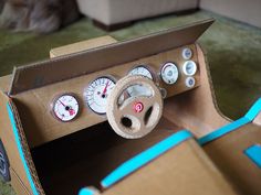 the inside of a cardboard box with gauges and dials on it's side