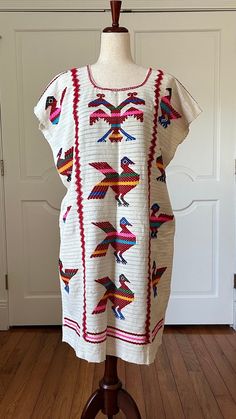 Traditional Chinantec huipil dress made on back strap loom by artisans from Oaxaca Mexico, perfect for all occasions. PC# B-771 APPROXIMATE MEASUREMENTS. around bust 51" shoulder to bottom hem 39" It's made with cotton. 100% back strap loom Fabric. Imported Made in Oaxaca Mexico Hand-crafted item -- color, size and/or motif may vary slightly. Boho,bohemian,handmade,Mexico, Hippie,Embroidery,Vintage,Tunic,One of A Kind. amuzgo. https://www.etsy.com/shop/BellaEmbroidered?ref=profile_header Hippie Embroidery, Huipil Dress, Hispanic Culture, Mexican Fashion, Embroidery Vintage, Bohemian Handmade, Profile Header, Back Strap, Dress Clothes For Women