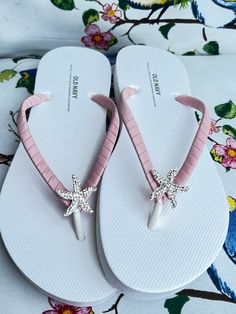 This beautiful flip flops is hand wrapped with a matte mauve ribbon and adorned silver starfish with rhinestones. Ribbon color is chalk mauve , if you are needing other colors of ribbon or decoration please contact me and will be happy to accommodate you! All flip flops are handmade to order and the production time is 5-7 business days and then please allow additional time for shipping. Amazing for beach, weddings, flower girl or a fancy event, you choose! Please choose your size from the drop b Adjustable Silver Flip Flops, Adjustable Silver Open Toe Flip Flops, Silver Flip Flops For The Beach, Silver Open Toe Flip Flops For Beach, Silver Round Toe Flip Flops For Vacation, Silver Summer Beach Sandals, Adjustable Open Toe Flip Flops For Beach Wedding, Beach Wedding Flip Flops, Bride Flip Flops