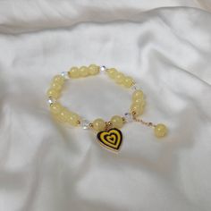 Don't miss out on this beautiful yellow heart charm bracelet. It works with a large variety of looks and add a bit of sparkle to your outfit. MORE jewellery pieces available on our shop! Any questions please message we are happy to help. Free postage in UK Thank you for shopping with us Heather&Bumble 📪Follow us at: Instagram: heatherandbumble Twitter: Heather_Bumble Pintrest: Heather & Bumble Yellow Retro Heart Bead Charm Bracelet - Bead Jewellery,Yellow Bracelets In The UK,Charm Bracelet,Yellow Bead Bracelets,Yellow Jewelley Adjustable Yellow Jewelry With Heart Beads, Yellow Beaded Bracelets With Heart Beads For Gifts, Yellow Beaded Bracelets For Friendship, Adjustable Yellow Beaded Charm Bracelet, Yellow Bracelets With 8mm Beads For Jewelry Making, Yellow Crystal Bracelet As A Gift, Adjustable Beaded Yellow Crystal Bracelet, Adjustable Yellow Beaded Crystal Bracelet, Yellow Beaded Charm Bracelet For Gift