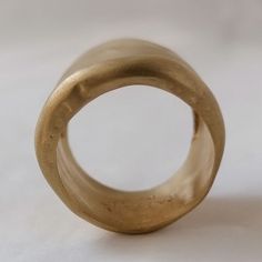 Gold Thick Band Engraved Ring, Gold Wide Band Ring For Promise, Yellow Gold Brass Rings With Thick Band, Gold Thick Band Promise Ring, Gold Polished Finish Wide Band Ring, Gold Wide Band Promise Ring, Unique Yellow Gold Wide Band Open Ring, Gold Wide Band Ring In Recycled Gold, Gold Thick Band Ring As Gift