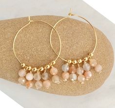 Moonstones in peach and grey colors dangle in either choice of silver plated hoops, sterling silver hoops, gold plated hoops, or 14k gold filled hoops. Can be made with or without hooks. 2 styles- Even or Uneven moonstone dangles. The Perfect bohemian earrings, perfect size and dangle. Super gorgeous with boho outfits. Light and comfortable. Make a statement today! 💜Simple, Dainty and Elegant Raw Natural Stones for everyday wear that's lasting. Simple yet elegant especially the shine and color Earrings Bohemian, Valentines Day Gifts For Her, Peach Moonstone, Beaded Hoop Earrings, Beaded Hoops, Bohemian Earrings, Earrings Boho, Bijoux Diy, Sterling Silver Hoops