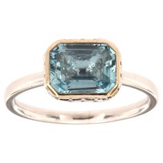 This 14k White gold delicate ring features a 1.70 Carat Blue Aquamarine emerald cut bezel set East-West style. Sixteen (16)Brilliant round diamonds are micro-prong set in a hidden halo on the crown to create the sparkle look every woman is looking to have. The diamond weight is 0.23 Carat, The band is 2 mm wide, and the ring size is 6.5 and resizable per request. Engagement Wishes, Hidden Halo, Aquamarine Rings, Halo Diamond Ring, Aquamarine Blue, Delicate Rings, Blue Gemstones, Ring Ring, Halo Diamond