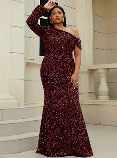 Tinged with elegance and charm, this burgundy prom dress is the epitome of sophistication and style. The gown features a chic one-shoulder design that provides a modern and stylish look, perfect for making a statement at any event. The entire dress is covered in sparkling sequins, which catch the light beautifully and add a touch of glamour. The fitted silhouette hugs your curves, creating a flattering and elegant appearance. The high-quality fabric ensures comfort and ease of movement, allowing Gown For Plus Size Women, Evening Dress Plus Size, Plus Size Evening Gown, Plus Size Wedding Gowns, Plus Size Gowns, Gown Plus Size, Evening Dresses With Sleeves, Sequin Evening Dresses, Evening Dresses Plus Size