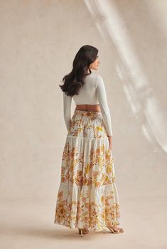 The Tora Long Skirt arrives in a pleasing pastel off-white hue and is adorned in a floral chintz pattern. The lightweight cotton schiffli style comes with a buckled belt and falls to a classic A-line silhouette with a straight hem grazing the ankles. It fastens with a concealed side zipper. Pair it with the Tora Bandeau Top and you're set to rock that beach party! Made In India Off White Cotton Schiffli Floral Chintz 100% Cotton Buckle Belt Included Straight Hemline Side Zip Closure Dry Clean On Jeans Long Skirt, Chintz Pattern, Floral Chintz, Hemant And Nandita, Long Linen Dress, Linen Scarves, Linen Short, St Barth, Buckle Belt