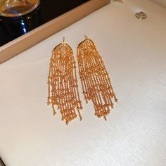 Material: Metal Fashion Element: Tassel, Love Heart/Heart Shape Style: Europe and America Elegant Tassel Earrings With Fringe As Gift, Gold Fringe Chandelier Earrings As Gift, Gold Fringe Tassel Dangle Earrings, Gold Dangle Tassel Earrings, Gold Dangle Tassel Earrings With Fringe, Metal Fashion, Long Earrings, Real Gold, Heart Shape