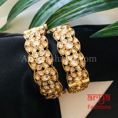 Beautiful Bridal Bangles with CZ Stones Features: Made in Brass with 22 Karat Gold finish Pair of 2 Bangles Thickness: Approx. 0.75 Inches Available in size 2.2, 2.4, 2.6, 2.8 Elegant Kundan Jeweled Bracelets, Elegant Adjustable Kundan Bangle, Elegant Kundan Bracelets For Celebration, Formal Jeweled Kundan Bangle, Elegant Kundan Bracelets For Party, Designer Gold Jewelry For Reception, Kada Bangles, Kundan Bangles, Bridal Bangles