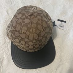 Brand New Coach Cap Designer Brown Baseball Cap, Designer Brown Hat For Spring, Designer Brown Hats For Spring, Designer Baseball Cap With Adjustable Short Brim, Designer Baseball Cap With Short Brim, Designer Adjustable Baseball Cap With Short Brim, Brown Baseball Cap With Flat Bill, Classic Brown Baseball Cap For Streetwear, Designer Black Spring Hats