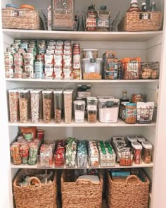 a pantry filled with lots of food and storage baskets on the bottom shelf next to each other