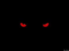 red eyes in the dark on a black background