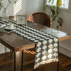 a table with a black and white checkered runner on it