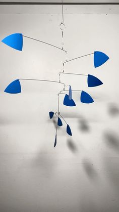 a blue wind chime hanging from a ceiling