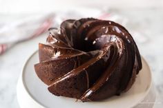 a chocolate bundt cake on a white plate