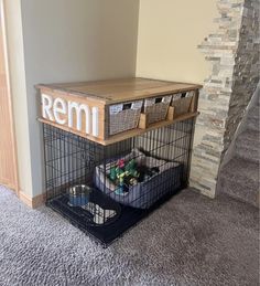 a dog cage with some toys in it and the word remi written on top