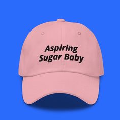 "It's everybody's dream... Be sure to pick up our new HILARIOUS hat design from HilariouSticker! This 20% sale will only be available for a short time after launch, so don't lose out! Comes in 6 different colors! Aspiring Sugar Baby Hat | Custom Design Funny Hat, Funny Hat for Teens, Funny gift for friends, funny hat for friends, funny hat for adults, adult humor hat clothing, sarcastic humor * 100% chino cotton twill * Green Camo color is 35% chino cotton twill, 65% polyester * Unstructured, 6- Funny One-size Dad Hat Baseball Cap, Funny Dad Baseball Cap, Novelty Letter Print Baseball Cap, Novelty Snapback Hat With Letter Print And Curved Brim, Funny Snapback Cap With Letter Print, Trendy Dad Hat With Letter Print And Short Brim, Fun Cotton Baseball Cap With Letter Print, Customizable Funny Snapback Hat, Pink Dad Hat With Letter Print