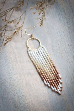 Fringe Beaded Earrings can be worn to work, a party, a wedding, or given as a gift. These earrings look beautiful by themselves or can be paired with a matching necklace.  ◆ MATERIALS ◆ * High Quality Nylon Thread * Glass Seed Beads in Various Colors * Hypoallergenic and Tarnish Resistant Ear Wire Hooks and Rings in Stainless Steel or 18K Gold Plated Stainless Steel      (Stainless Steel is a darker silver color) ∙ ∙ ∙ ∙ ∙ ∙ ∙ ∙ ∙ ∙ ∙ ∙ ◆ Sizing and Appearance ◆  * Length with the hook: 3.75 inches  * Length without the hook: 3.25 inches * The photos may be slightly different colors depending on the settings of your screen. In reality, the colors are rich and bright. ∙ ∙ ∙ ∙ ∙ ∙ ∙ ∙ ∙ ∙ ∙ ∙ ⋄ Handmade Boho Fringe Beaded Jewelry.  ⋄ If you would like customization please let me know. ∙ ∙ ∙ Bohemian Beaded Dangle Earrings For Wedding, Bohemian Dangle Hoop Earrings For Weddings, Bohemian Round Beads Earrings For Wedding, Bohemian Colorful Beads Earrings For Wedding, Bohemian Wedding Earrings With Colorful Beads, Bohemian Wedding Earrings With Round Beads, Bohemian Beaded Earrings For Wedding, Bohemian White Beaded Earrings With Chain, Bohemian White Beaded Chain Earrings