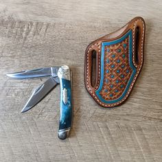 This listing is for both the knife and the sheath. The knife is a Rough Rider trapper with two blades and a turquoise bone handle and it is very sharp. Closed the knife measures 3 3/4''. This is a pancake style knife scabbard with a hand tooled floral pattern. The sheath is designed to sit on your right hip or on your back at a  45 degree angle. This sheath is made to to last for years. The sheath is made to fit a 1 1/2'' belt, if your belt is larger please message so a sheath can be mad to your Knife With Sheath, Western Knife Sheath, Tooled Knife Sheath, Knife Sheath Ideas, Pancake Knife Sheath, Knife Scabbard, Western Knife, Leather Knife Sheath Pattern, Cowgirl Accessories