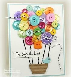 a card with buttons on it that says the sky's the limit, and is decorated