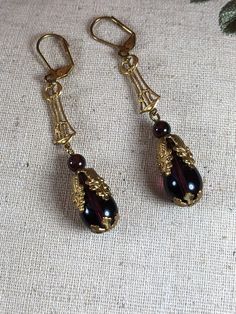 Vintage Bronze Teardrop Earrings, Vintage Formal Jewelry With French Hook, Antique Teardrop Ear Wire Jewelry, Antique Handmade Evening Earrings, Handmade Victorian Earrings For Vintage Events, Antique Handmade Earrings For Evening, Vintage Purple Drop Earrings, Vintage Purple Teardrop Earrings, Vintage Teardrop Pierced Earrings