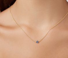 14K SOLID YELLOW GOLD EVIL EYE NECKLACE Here is a dainty, delicate and simple, yet classy minimalist Evil Eye Necklace . This is 14k Solid Yellow Gold. ( We do not sell filled or plated jewelry) Perfect for everyday use. -PRODUCT DETAILS - Metal : 14K SOLID GOLD Necklace Length : 17.5 Inches / 43.75cm Pendant Height : 4.65mm Pendant Width : 4.65mm Shipping Policy Item will be shipped within 1-3 business days of receiving full payment. Return Policy -You may return the unused item in its original Evil Eye Gold Chain, Dainty Evil Eye Necklace, Evil Eye Gold Necklace, Nazar Necklace, Round Evil Eye, Gold Evil Eye Necklace, Classy Minimalist, Good Luck Necklace, Evil Eye Necklace Gold