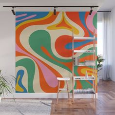 an abstract wall mural with multicolored swirls on the walls and flooring