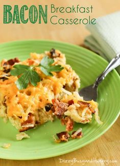 bacon breakfast casserole on a green plate with a fork