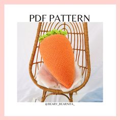 a knitted carrot sitting on top of a pillow in a wicker chair with text overlay that reads, pdf pattern