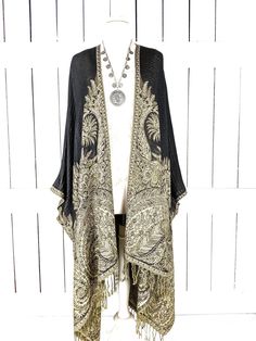 Black beige floral pashmina kimono cover up jacket with custom lengths and fringe detail Measurements...taken flat - width across seam to seam: 46"  - regular length with fringe: 38"  - regular length without fringe: 34"   length note.... the sides hang a bit lower than the front and back when worn due to the design of the caftan. For reference... a 48" kimono is generally floor length on a person who is 5'8  Features... - lovely soft woven medium weigh pashmina fabric - bohemian oversized flowing design - cardigan style with an open front and generous arm holes  - universal design allows a comfortable fit for small through plus sizes - the perfect layering piece that can easily be dressed up or down - wrinkle resistant  - handmade with love by me in California Add a matching attached hood Bohemian Beige Pashmina Shawl, One Size Bohemian Kimono With Fringe, Bohemian Fringe Kimono One Size, Bohemian One Size Fringe Kimono, Bohemian One Size Kimono With Fringe, Bohemian Shawl With Tassels For Spring, Bohemian Spring Shawl With Tassels, Bohemian Fringe Shawl For Spring, Spring Shawl With Tassels