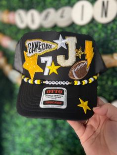 Friday Night Lights hair? Don't care!  Every football mom needs one of our custom trucker hats to wear on Friday nights. I also have different colored footballs, baseballs, softballs, soccer balls, hockey sticks, volleyballs and basketballs!   All our hats are totally customizable, so message us to request custom colors or patches. We can build a custom listing just for you! Ball Cap Design, Football Mom Outfit, High School Spirit, Hat Chain, Football Life, Football Jacket, Drill Team, Patch Hats