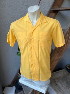 "This superb, genuine 1980s collared shirt is in excellent vintage condition! It' is roughly the color of Florida gulf coast summer twilight. I'd say the picture on the mannequin shows the truest color. Made by Islander. Check the measurements: SIZE: Pit to pit: 21\" Collar to hem: 28\" Sleeves: 8\" The tag says medium. Check the measurements. The male mannequin would be about 5'10\", 175 lbs. ITEM 622" Solid Color Johnny Collar Summer Shirt, Solid Color Johnny Collar Shirt For Summer, Solid Johnny Collar Summer Shirt, Solid Johnny Collar Shirt For Summer, Orange Cotton Camp Shirt For Summer, Summer Orange Cotton Camp Shirt, Classic Orange Summer Shirt, Classic Collared Hawaiian Shirt For Summer, Orange Cotton Hawaiian Shirt For Summer