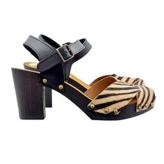 A soft model, with clean and elegant lines, these sandals are a real passe partout. Clogs with Brown Wood effect base Upper with crossed bands in genuine Tuscan leather, zebra effect Adjustable ankle strap, open toe Anti-slip suede insole Heel height 7 cm with 2 cm platform Entirely made in Italy Craftsmanship. BEFORE COMPLETING YOUR PURCHASE DO NOT FORGET TO CHECK THE SIZE! Synthetic Slingback Sandals With Wooden Heel, Leather Cross Strap Heels With Padded Heel, Chic Brown Cross Strap Sandals, Chic Sandals With Cross Strap And Removable Insole, Chic Cross Strap Sandals With Removable Insole, Brown Synthetic Sandals With Cross Strap, Brown Synthetic Cross Strap Sandals, Leather Sandals With Padded Heel And Cross Strap, Brown Sandals With Heel And Cross Straps